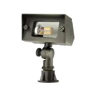 die-cast brass wash light with bronze finish standing upright showing clear lens with silicone g4 lamp and adjustable knuckle.
