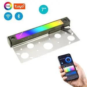 A 7" brass hardscape light with stainless steel mounting brackets and smart color changing options via wireless connectivity, as denoted by a hand holding a phone with the options available visible on screen at the bottom right and icons showing the various functionalities in the top left of the image.